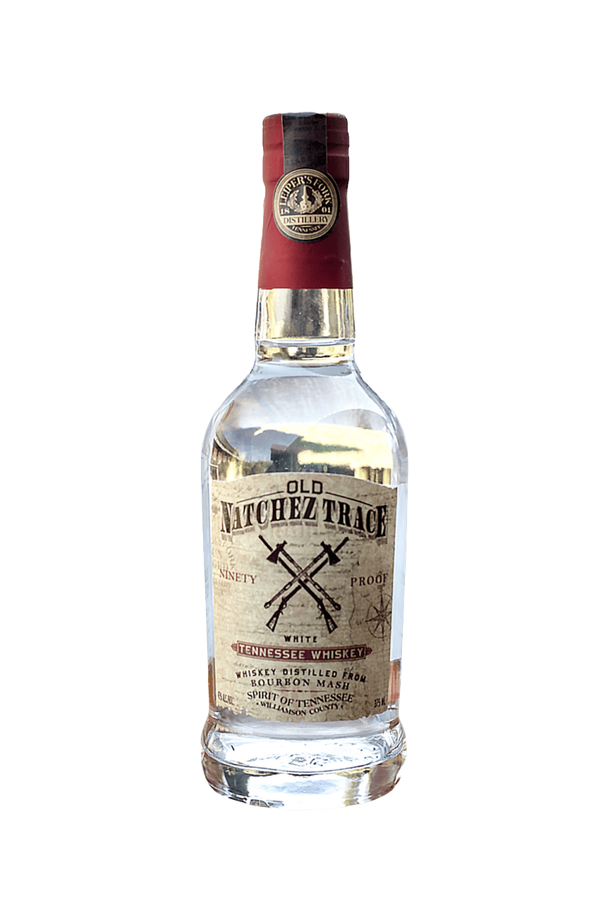A clear glass bottle of Old Nutchez Trace Tennessee whiskey with a red cap and a beige label featuring crossed rifles and text. user-items-list-carousel__media bottle from Leiper’s Fork Distillery