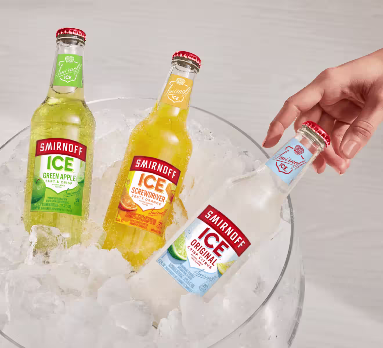 Three bottles of Smirnoff Ice in an ice bucket bottle from Smirnoff Flavored Vodka Works