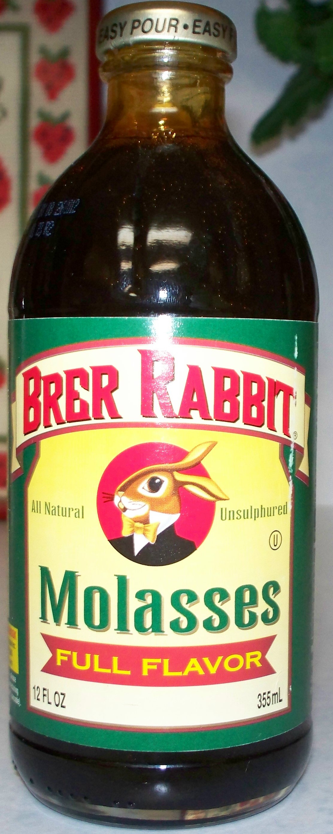 Dark cane molasses in a clear bottle